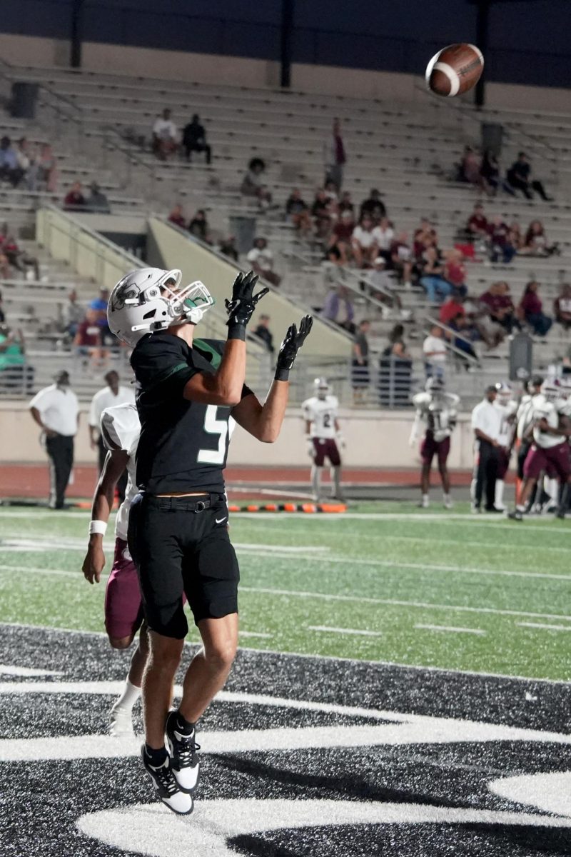 During the first quarter, junior Dane Solomon catches a touchdown pass from senior quarterback Aaron Gilliam against Ft. Bend Kempner.