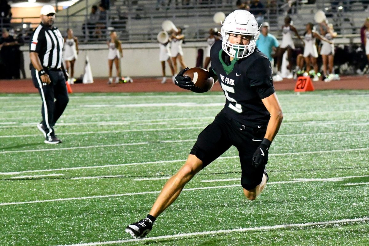 Junior Dane Solomon runs with the ball, before running out of bounds in a game against Fort Bend Kempner.