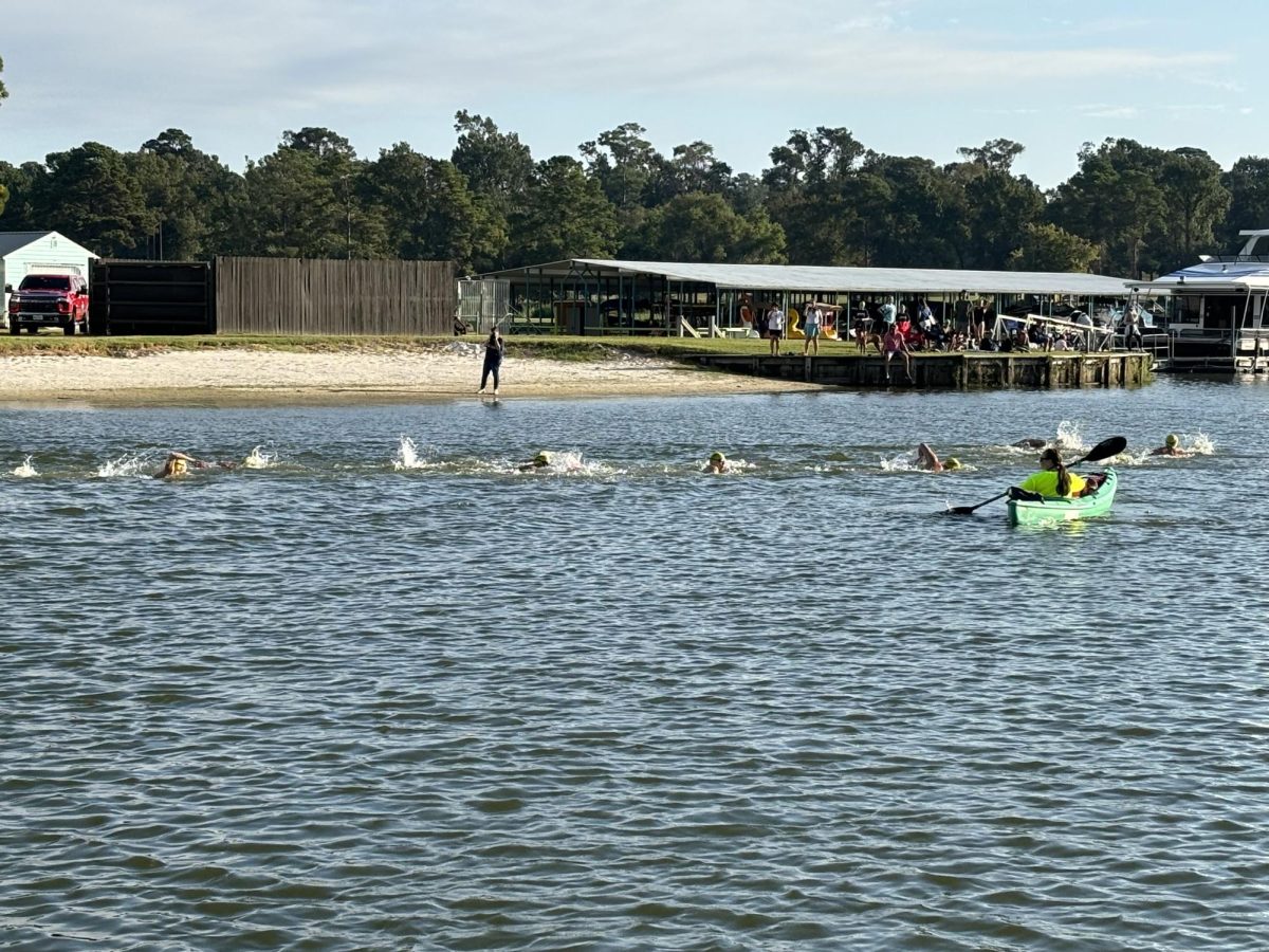 The swimmers compete in the one-mile event at Lake Conroe in Margaritaville on Oct. 5. The Kingwood Park swimmers raised more than $8,000 for the charity event. Photo submitted by Nancy Wakefield.