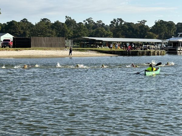 The swimmers compete in the one-mile event at Lake Conroe in Margaritaville on Oct. 5. The Kingwood Park swimmers raised more than $8,000 for the charity event. Photo submitted by Nancy Wakefield.