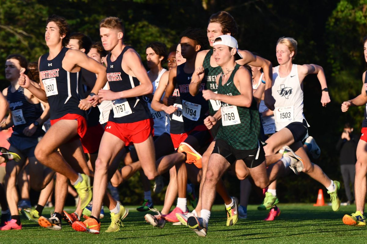 Seniors Carson Brown and Elijah Meino sprint out of the box to start the 5k race on Sept. 28.