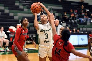 Before getting fouled by a Aldine MacArthur defender, senior Asia Martin pulls up for a jump shot.