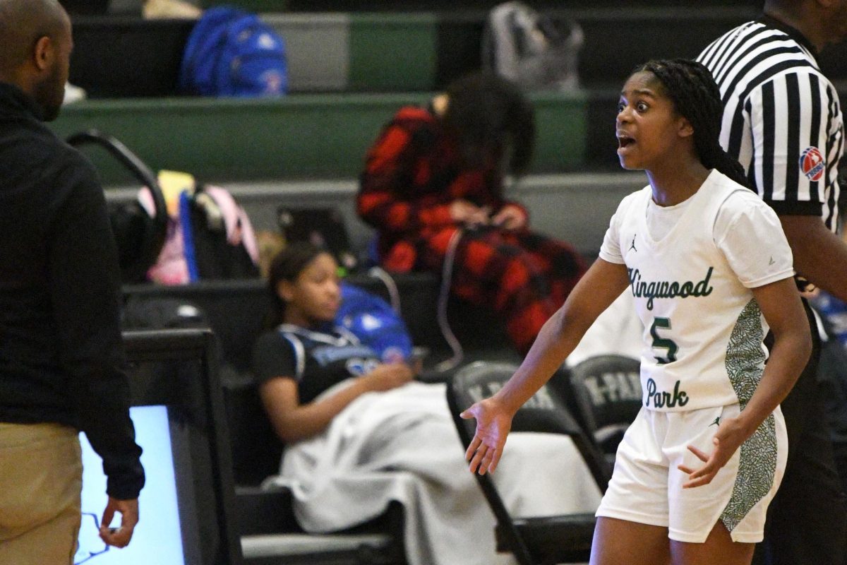 Senior Aniah Cross shouts in frustration at coach Andrew Cross after she gets called for a foul.