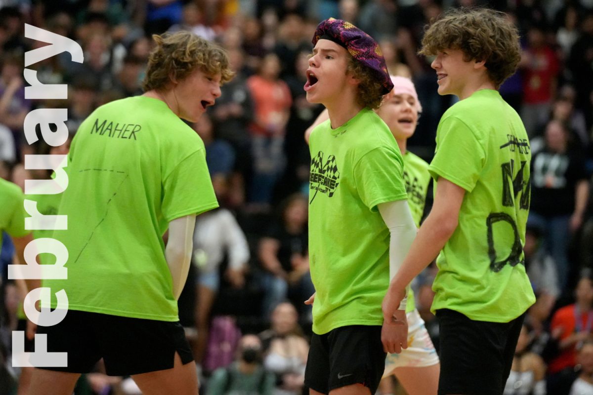 Freshmen Grant Maher, Kyle Lee and Asher Rennard celebrate a point during their beefcake match against the teachers.