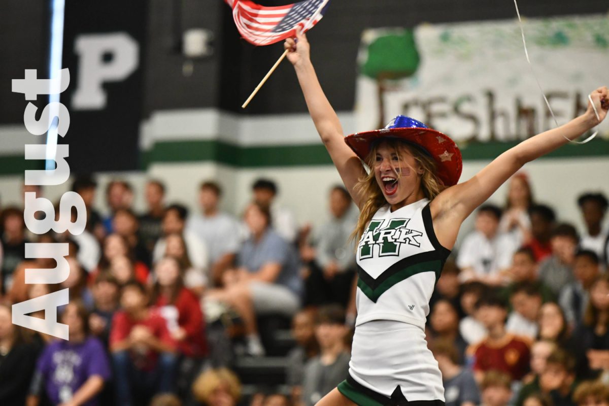 Madison Staggs celebrates on top of the junior class pyramid. The juniors won the competition. 