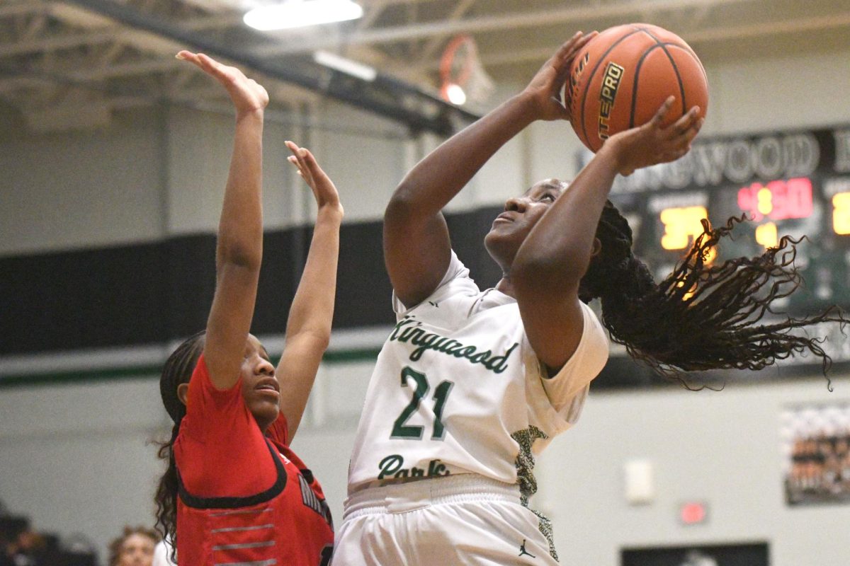 Senior Anya Henry takes a shot against Aldine MacArthur during a 49-27 victory on Nov. 12.