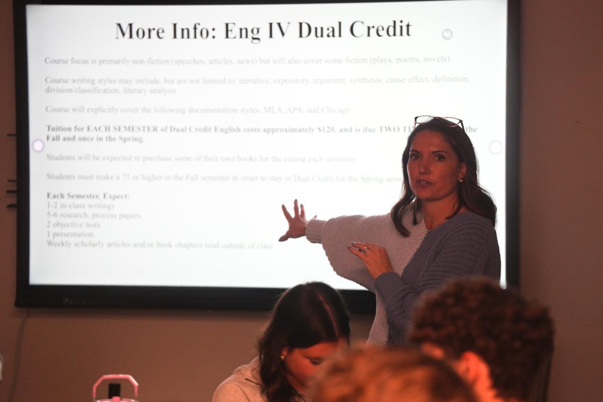 English teacher Abby Wyllie talks with her students about their senior English course options during Course Selection Day on Jan. 13. 