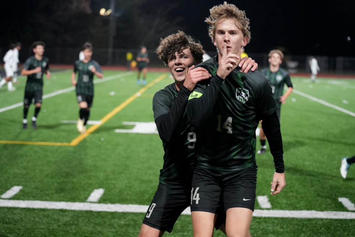 After scoring a goal, senior Chase Bennett and junior Ronan Flaherty sprinted to the sidelines to celebrate.