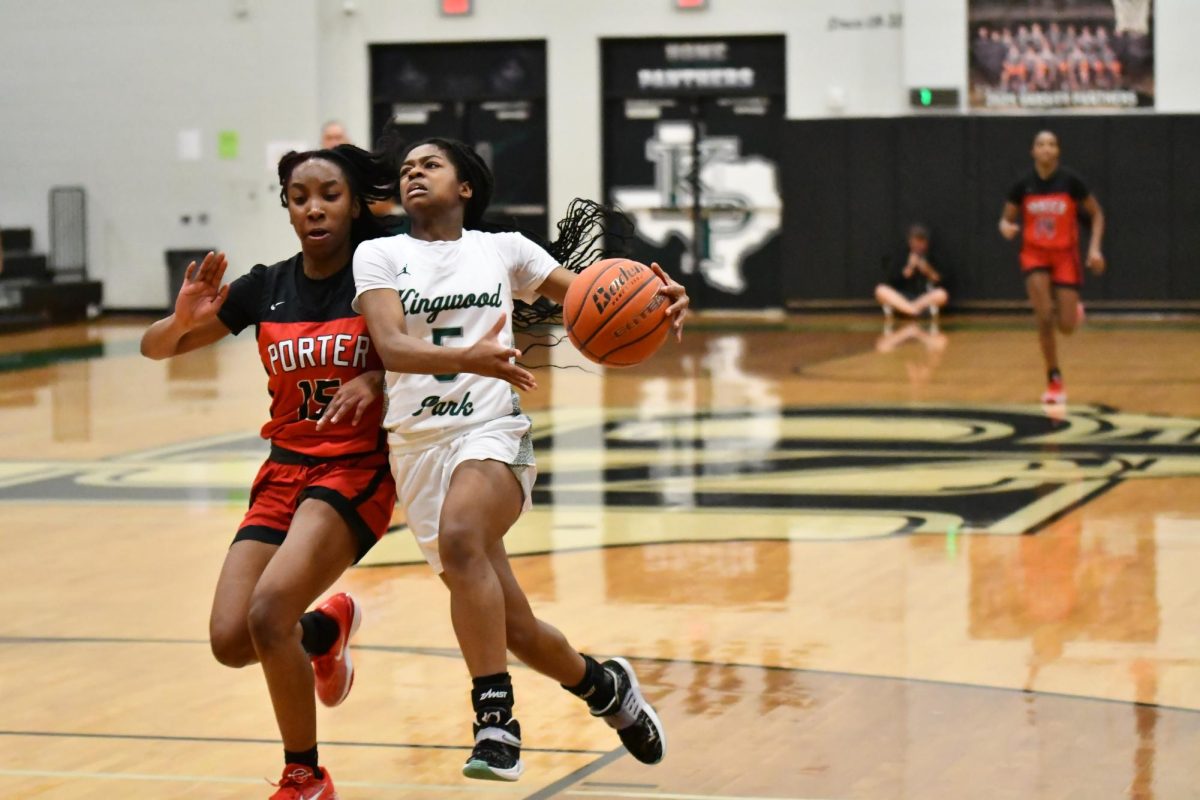 Senior Aniah Cross runs up for a layup while being pressured by Porter’s defense during their game on Jan. 7.