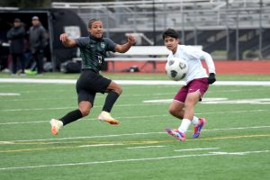 Sophomore forward Kye Wehby takes a shot on goal from the top of the box against Cy-Fair on Jan. 10. 