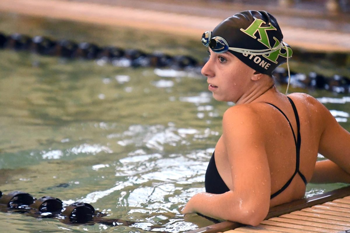 Junior Marisa Stone rests on the wall during a home meet against Summer Creek High School meet on Sept. 20. 