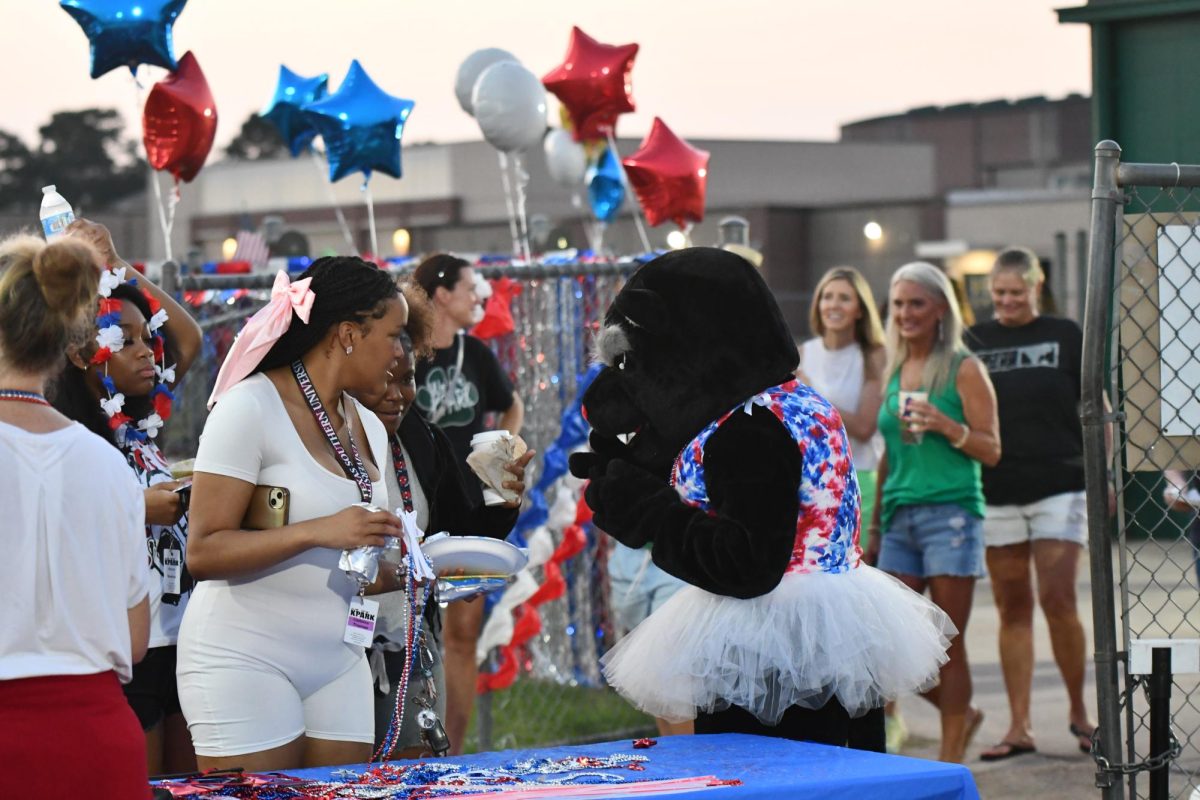 Katie the Panther, played by Ella
Yarbrough, welcomes students as
they get breakfast at Senior Sunrise.