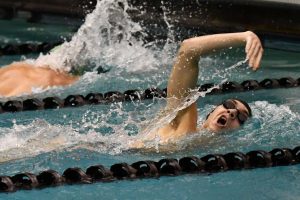 Senior Gabe Fabrizio competes in the freestyle in a home meet on Jan. 10. Fabrizio advanced to the Region Meet in four events/