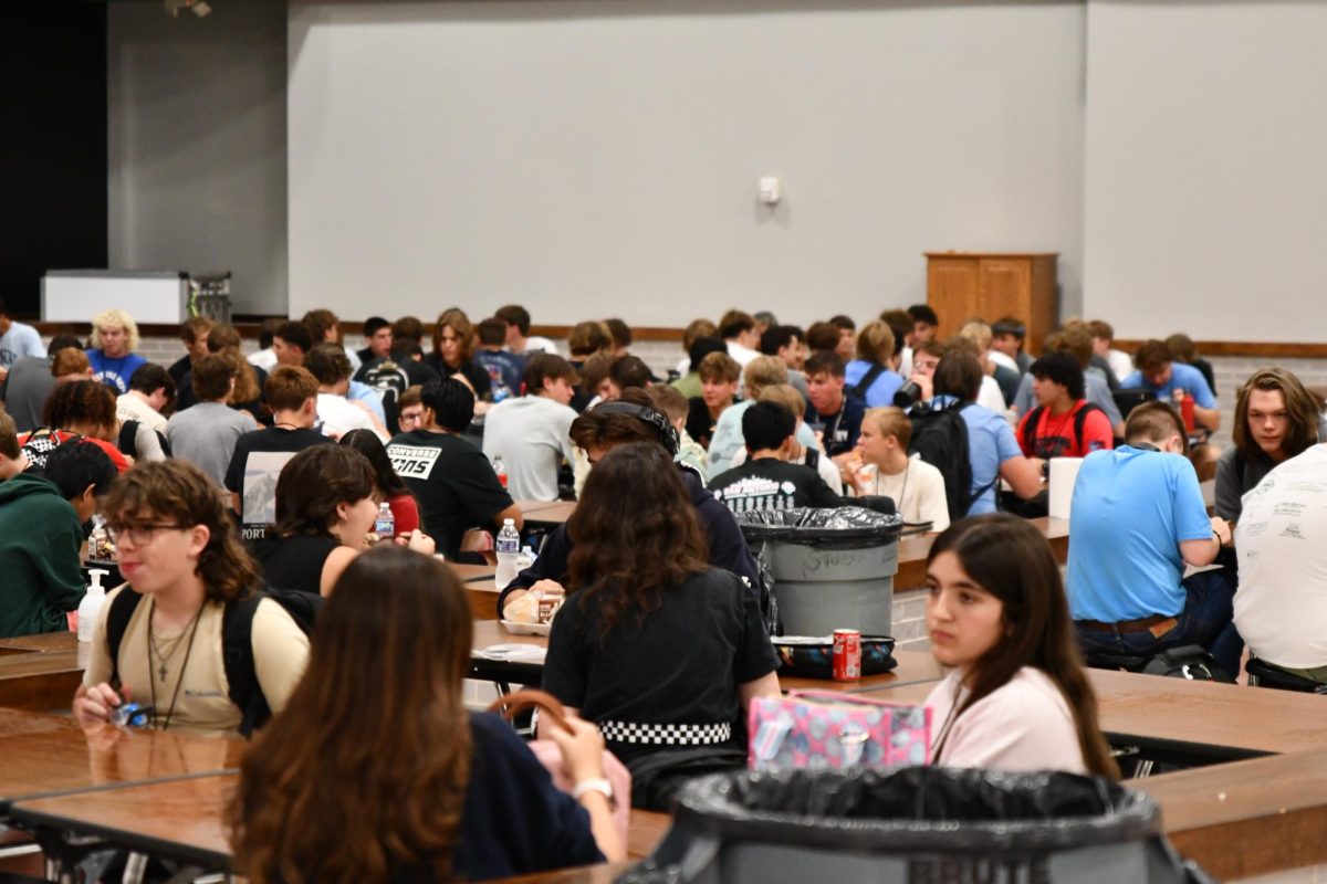 Students pack into the cafeteria on a four-lunch schedule in August. While the four-lunch schedule is usually implemented only on Tuesdays, there has been an increased frequency of
the schedule before and after breaks. When the normal hour-long lunch is eliminated, students lose study time, tutoring time and time with friends.