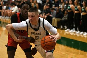 Senior Carson Conner drives toward the hoop against Porter on Jan. 31.