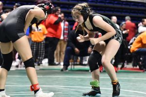 During the first round of consolation, senior Khloe King watches her opponent, Julieta Chapa, in the neutral position. King wrestled in two matches before being eliminated at the State Championships.