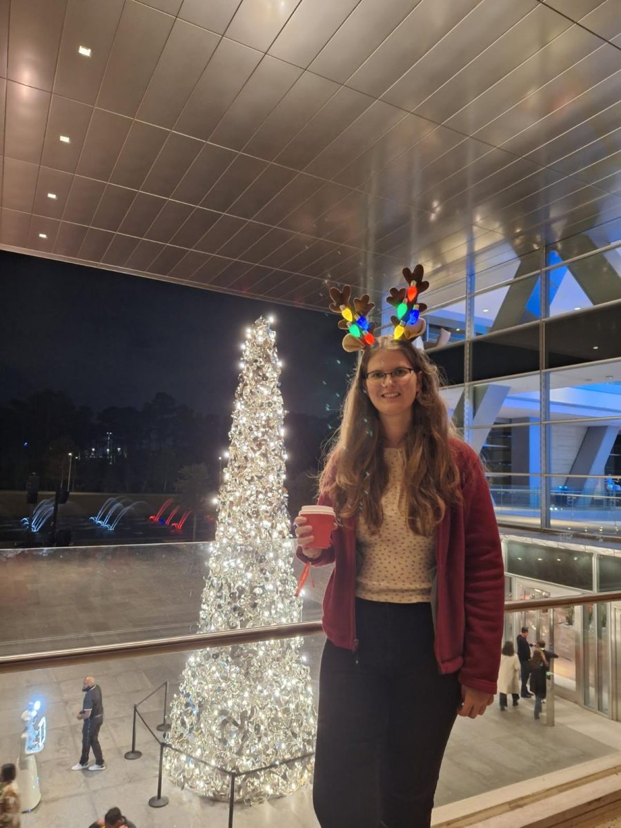 Junior Michelle Klanke poses for photo at her host dad's work Christmas party. Photo submitted by Michelle Klanke.