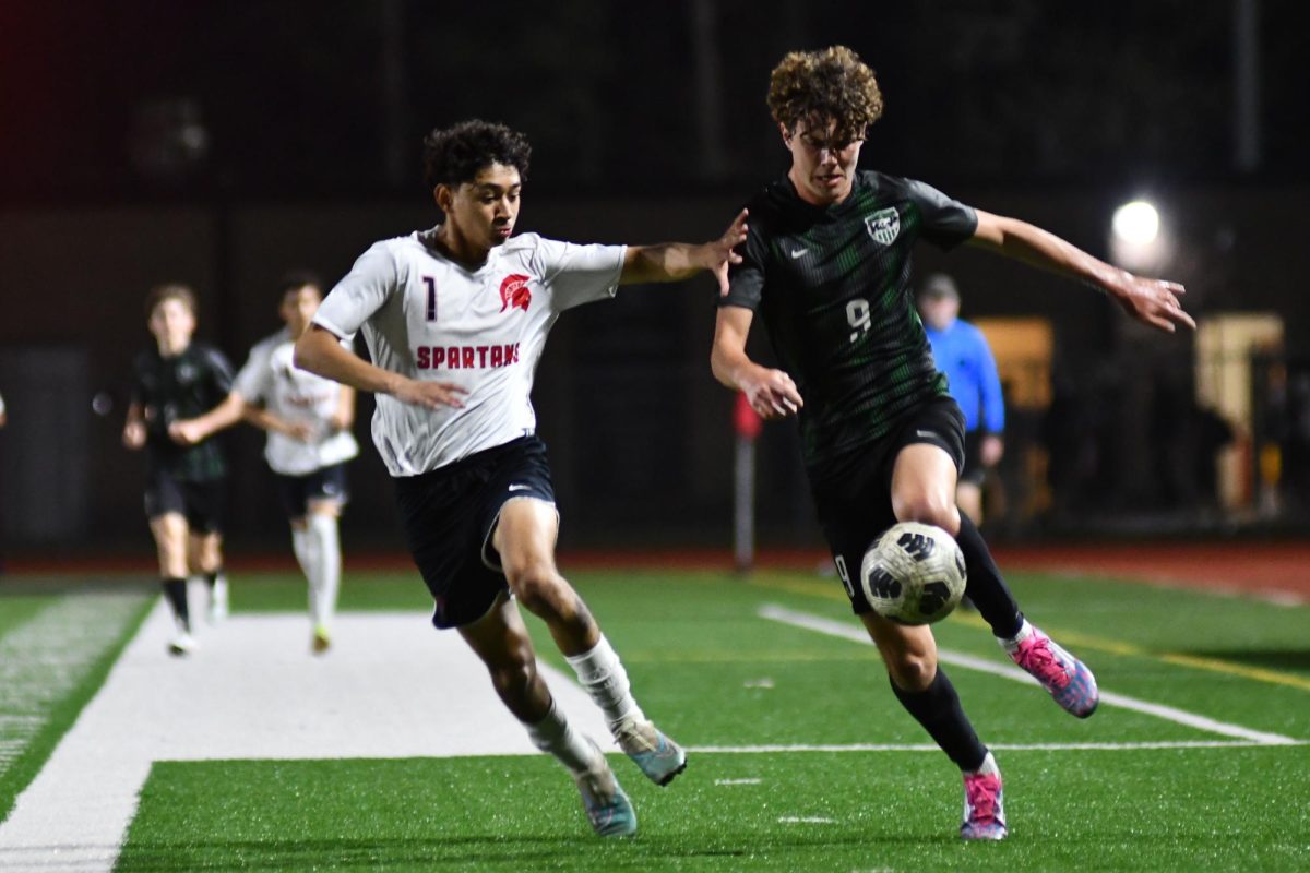 Junior Ronan Flaherty dribbles up the field in a 4-1 victory over Porter. 