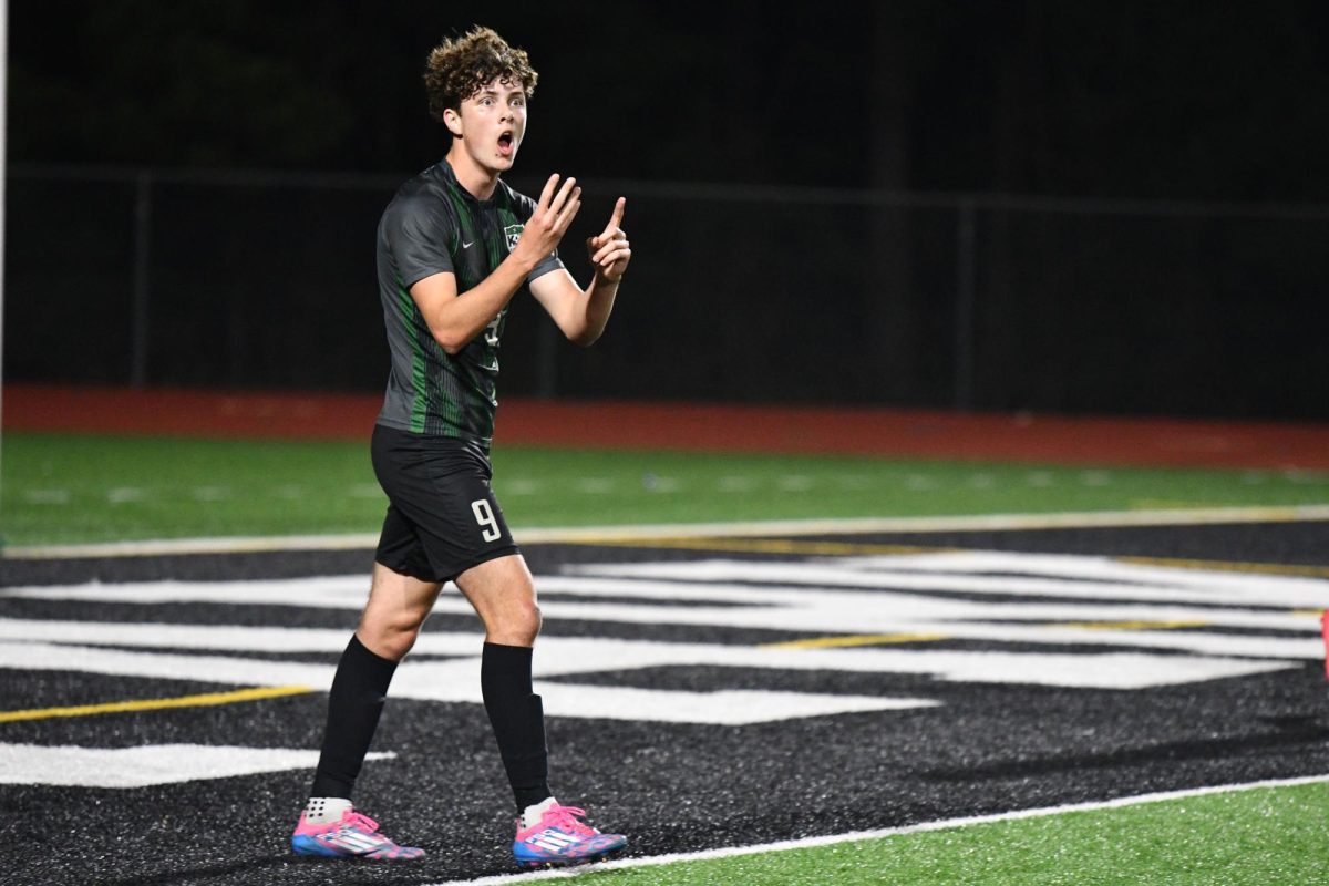 Junior Ronan Flaherty celebrates during the Porter game. He had a goal and an assist in the 4-1 win.