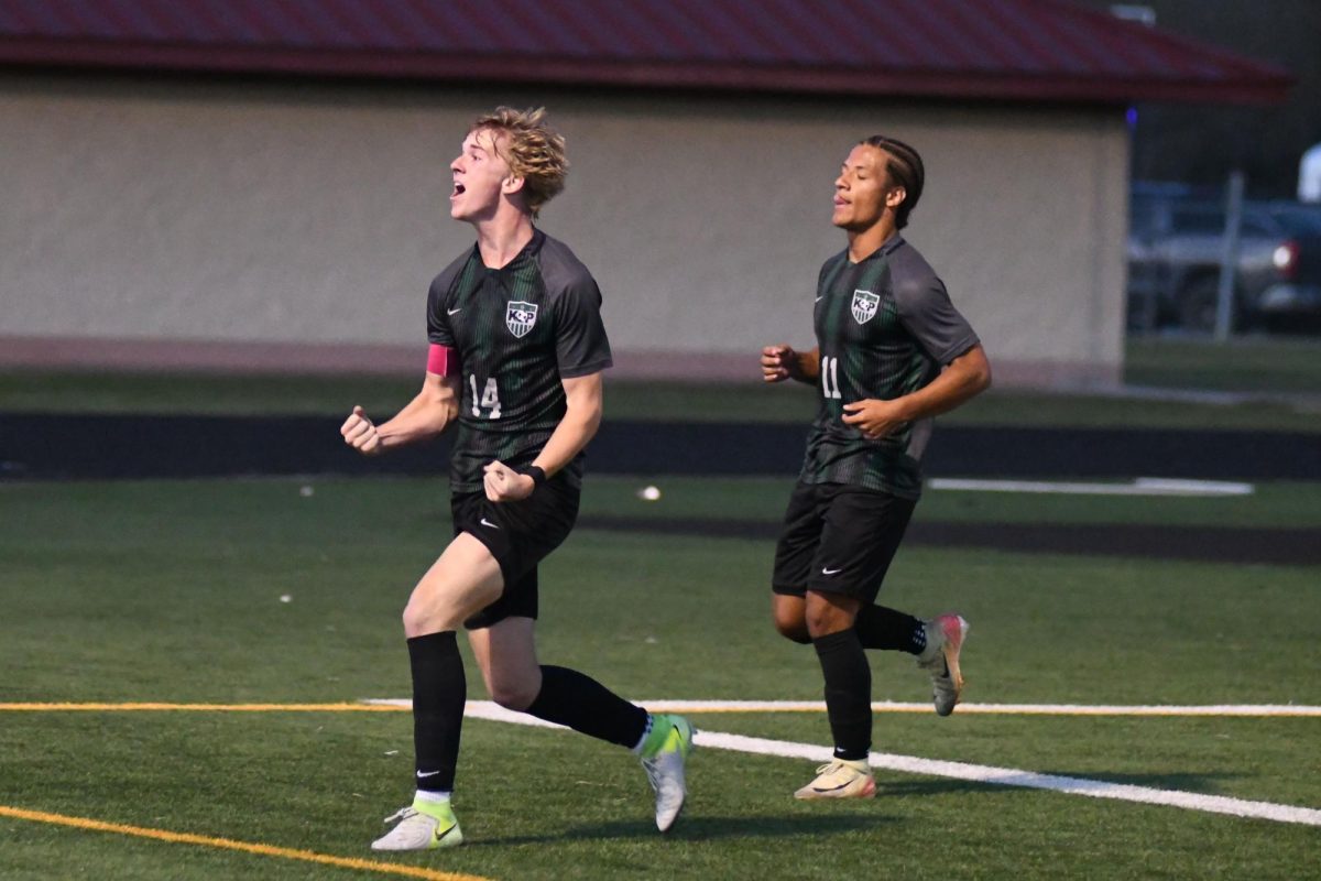 Senior Chase Bennett and sophomore Kye Wehby celebrate Bennett’s goal against Rudder. Bennett had two goals in the 4-2 victory.
