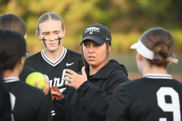 Head coach Lindsay Gregory talks to her players in huddle toward the end of the team’s win over Porter on March 21. 