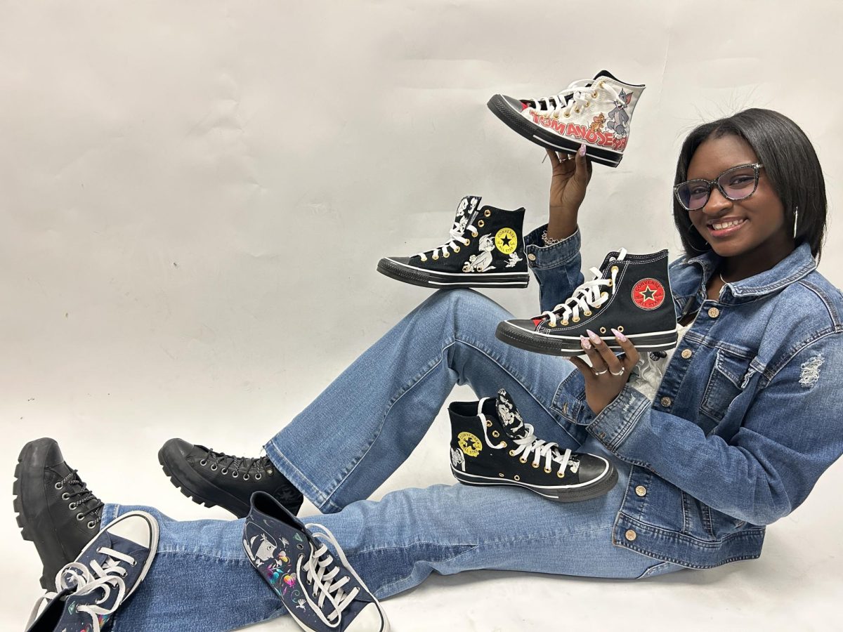 Junior Paisley Thomas shows up some of her favorite Converse sneakers. She has collected 14 pairs over the years.