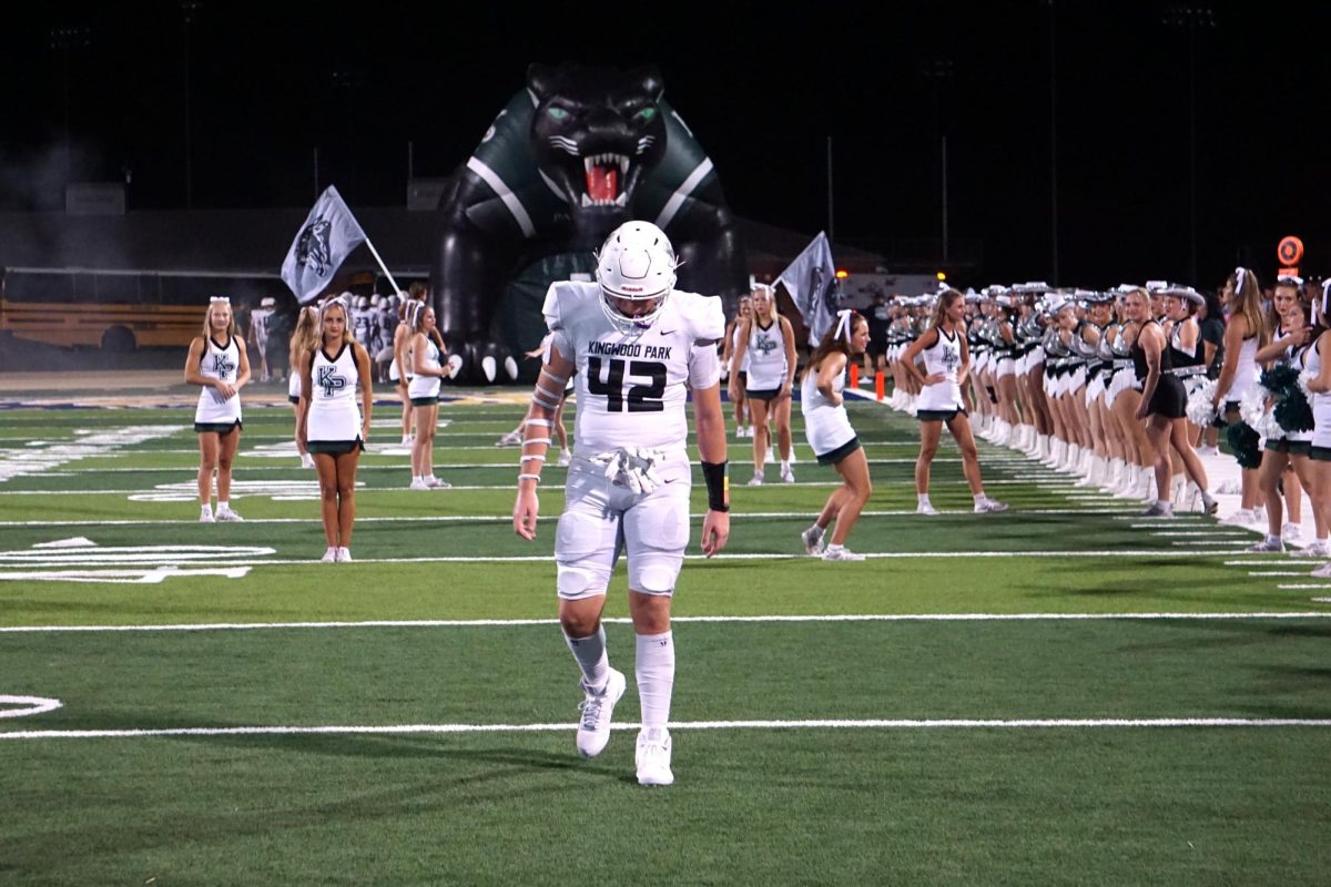 Senior Hagen Smith stands in front of the panther tunnel before the team runs out to start the second half.
