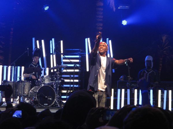 Frank Ocean holds out his microphone to the crowd while performing at Coachella 2012. Photo courtesy of David Hwang/Flickr/CC.