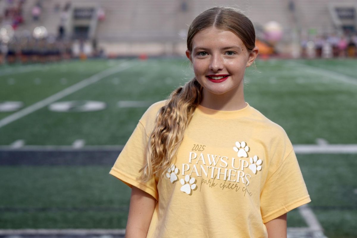 Freshman Lila Evans cheered at her first home varsity football game on Sept. 13 at Turner Stadium.