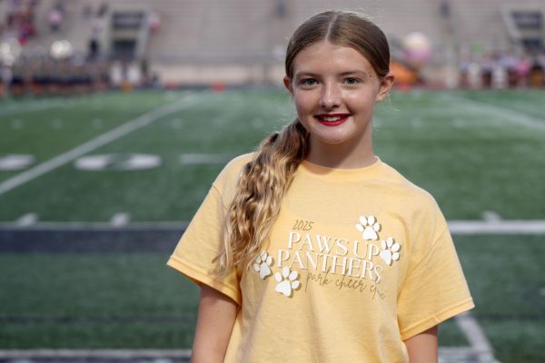 Freshman Lila Evans cheered at her first home varsity football game on Sept. 13 at Turner Stadium.