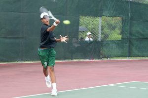 Sophomore Dominic Salazar competes against Magnolia earlier this season. The tennis team went undefeated in district play and will face Montgomery in the Bi-District Championship on Oct. 7.