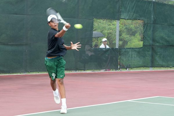 Sophomore Dominic Salazar competes against Magnolia earlier this season. The tennis team went undefeated in district play and will face Montgomery in the Bi-District Championship on Oct. 7.