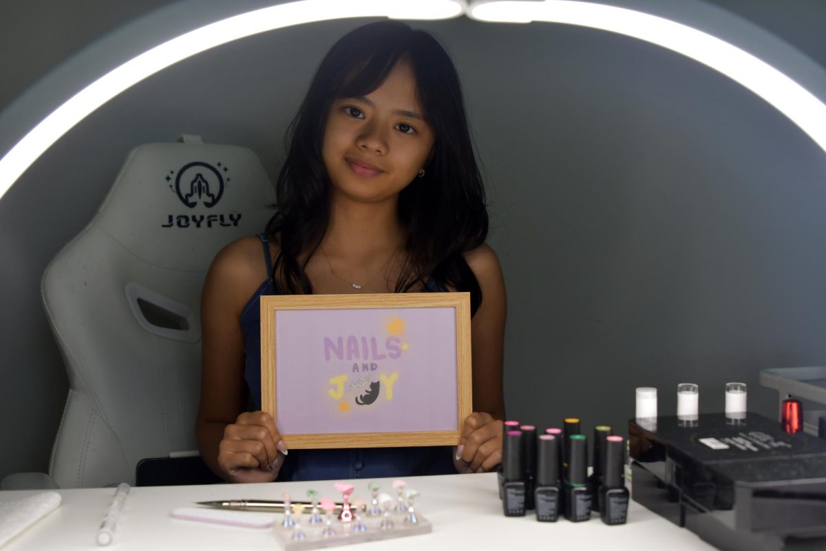Senior Joy Wiscovitch showcases her workspace at Nails and Joy. She started her own business to give her a creative outlet for her art skills.
