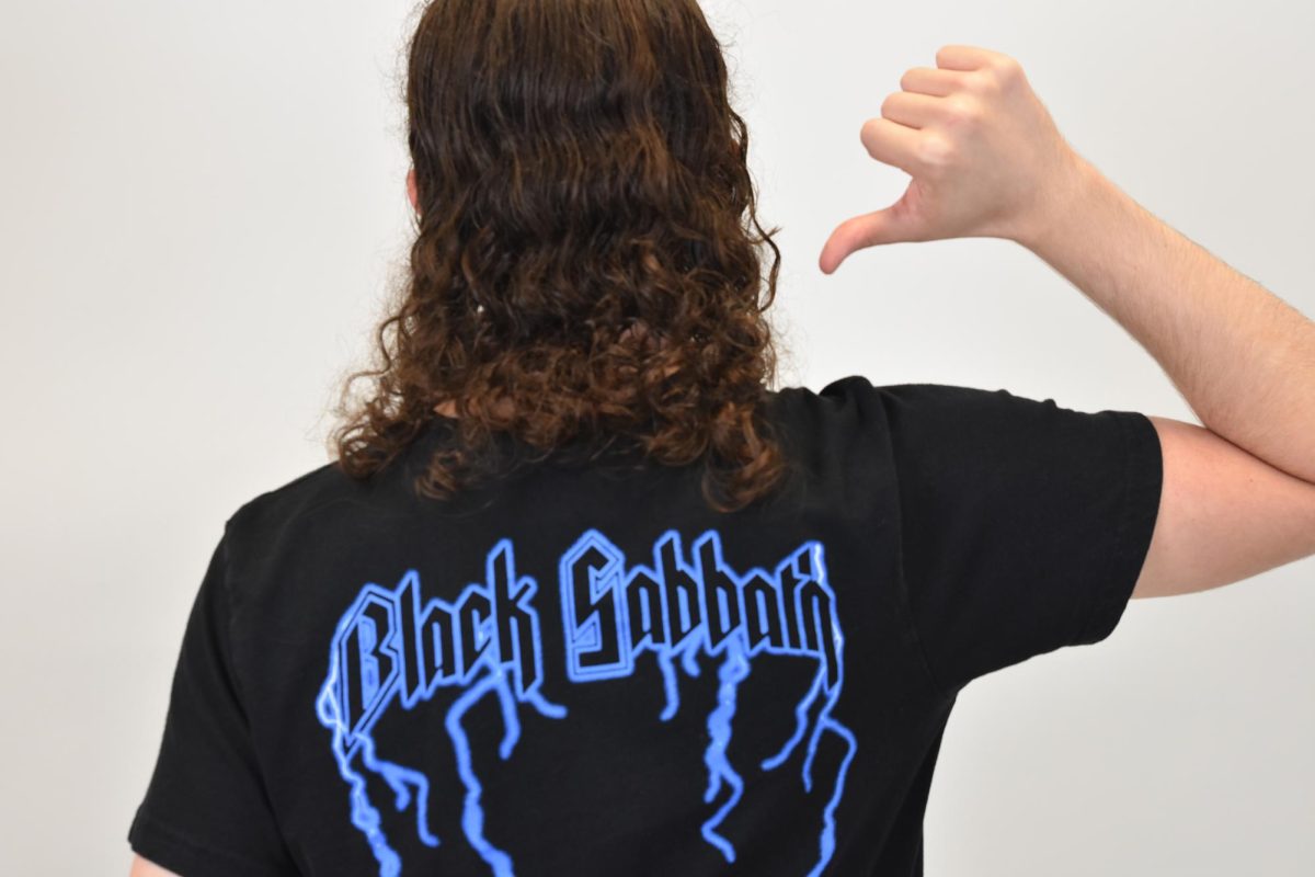 Senior Aaron Kellar showcases the tshirt of one of his favorite bands Black Sabbath.