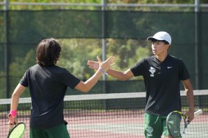 Senior Edun Almeda and sophomore Jaylen Macapaz go to shake hands with each other after scoring against Montgomery.