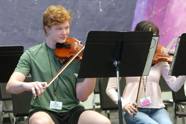 Junior Brock Hirschfield plays the violin during practice on Nov. 3. During Region tryouts, he earned 2nd chair violin in the Symphony Region Orchestra.
