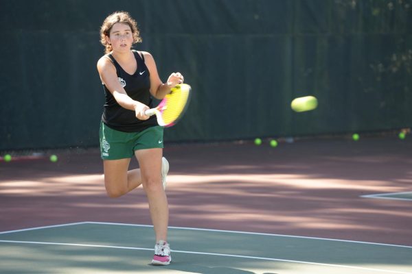 Sophomore Katya Bergquist hits a forehand during JV tennis practice on Nov. 4. She is in her second year playing tennis. 