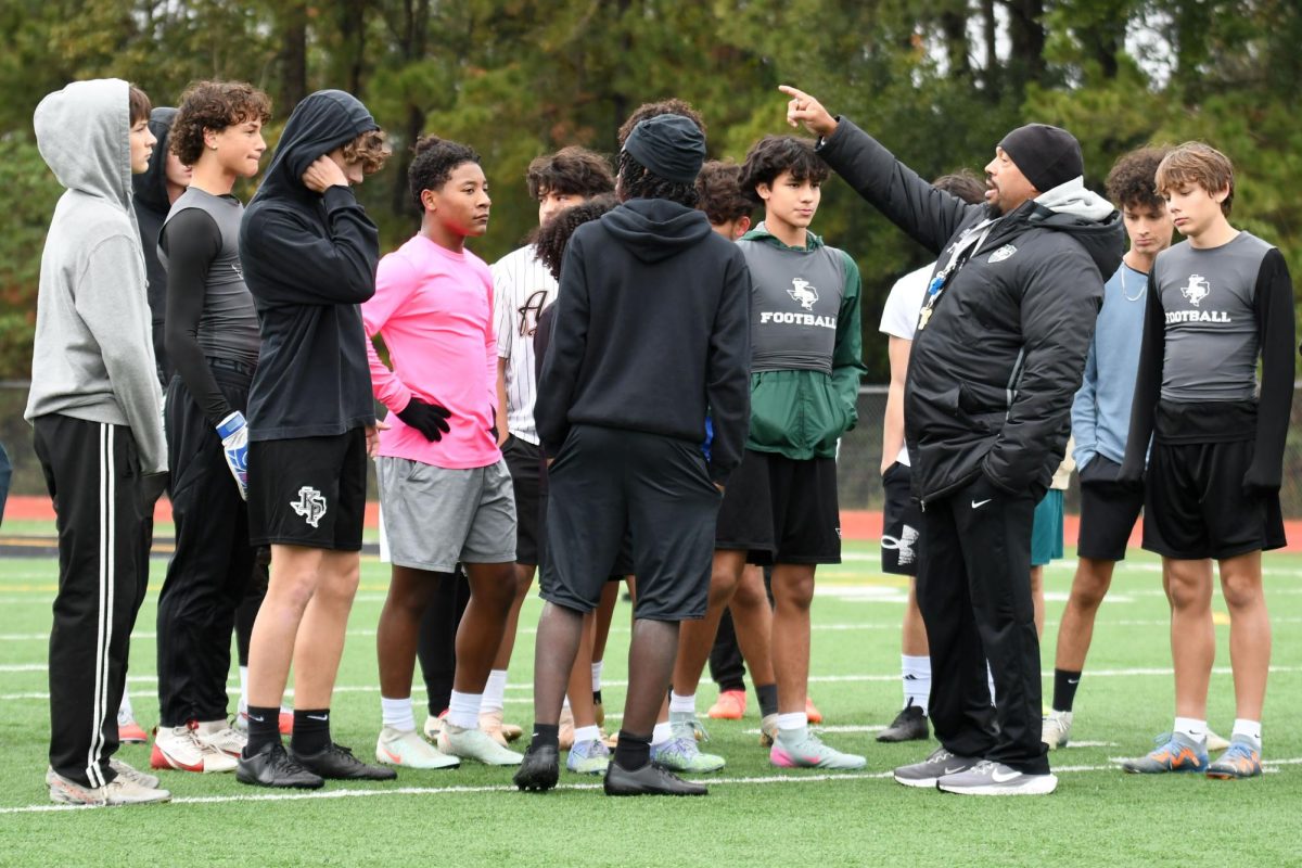 Boys soccer coach Richard Terry directs the team before practice outside on Dec. 4 when the temperature in Kingwood fell below 45 degrees.