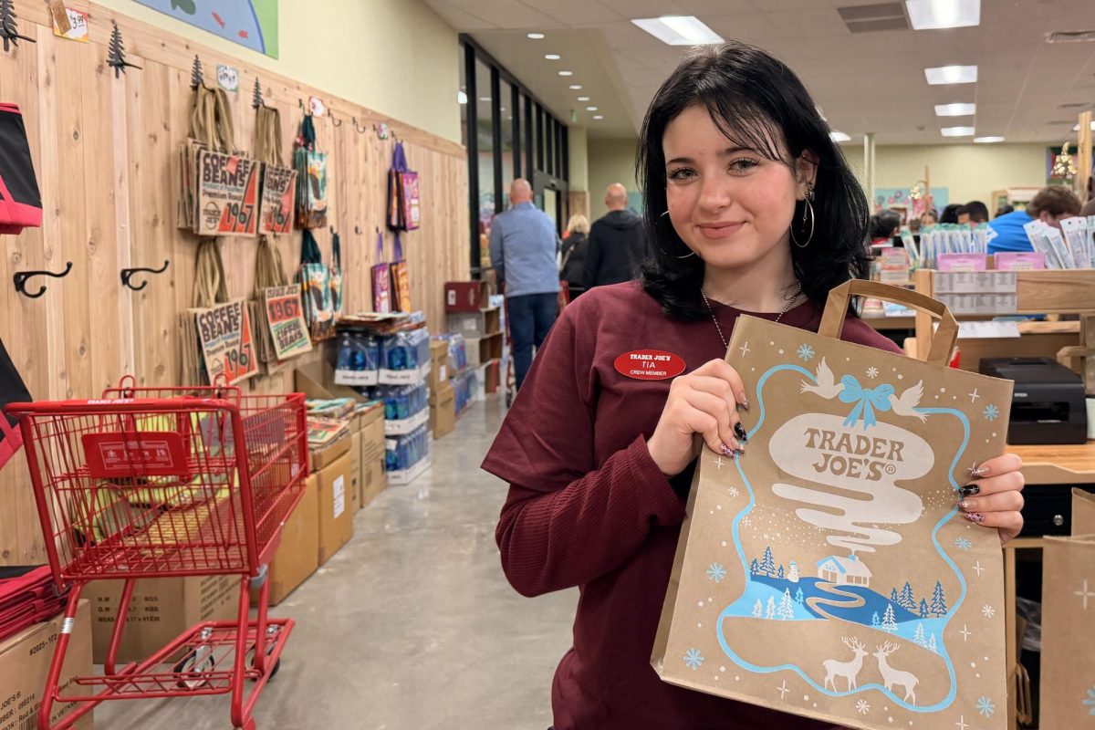 Senior Tia Thompson working at Trader Joe's on opening day Dec.5.