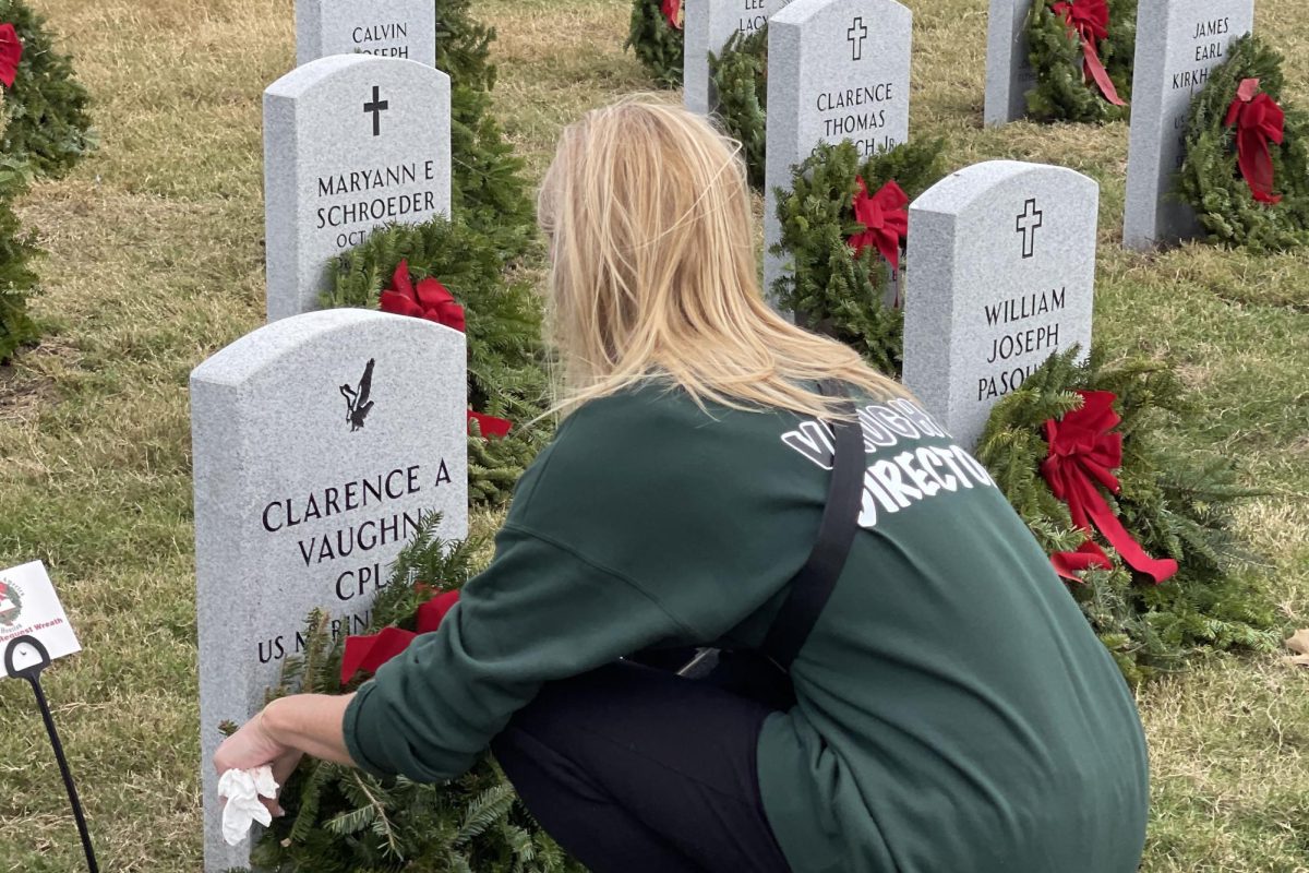 During the Wreaths Across America event at the Houston National Cemetery, dance teacher Cyndi Vaughn leaves a wreath at her father’s grave in 2024. She will return to the event to volunteer with Silver Stars again this year. Photo submitted by Cyndi Vaughn.
