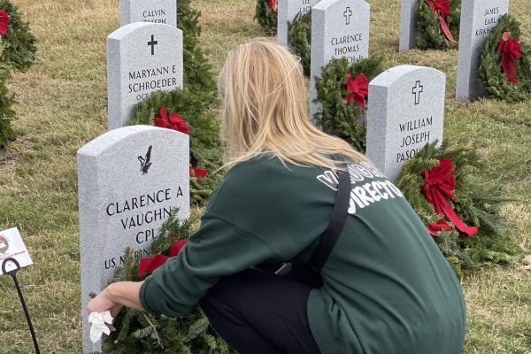 During the Wreaths Across America event at the Houston National Cemetery, dance teacher Cyndi Vaughn leaves a wreath at her father’s grave in 2024. She will return to the event to volunteer with Silver Stars again this year. Photo submitted by Cyndi Vaughn.