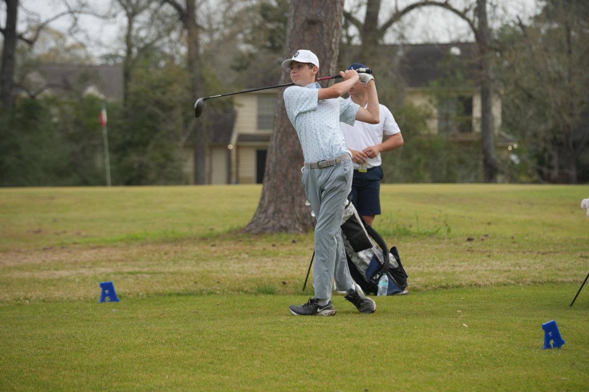 Sophomore Parker McGehee watches his ball in the back swing during a tournament at Atascocita last spring.  McGehee will return back as a top player this year.