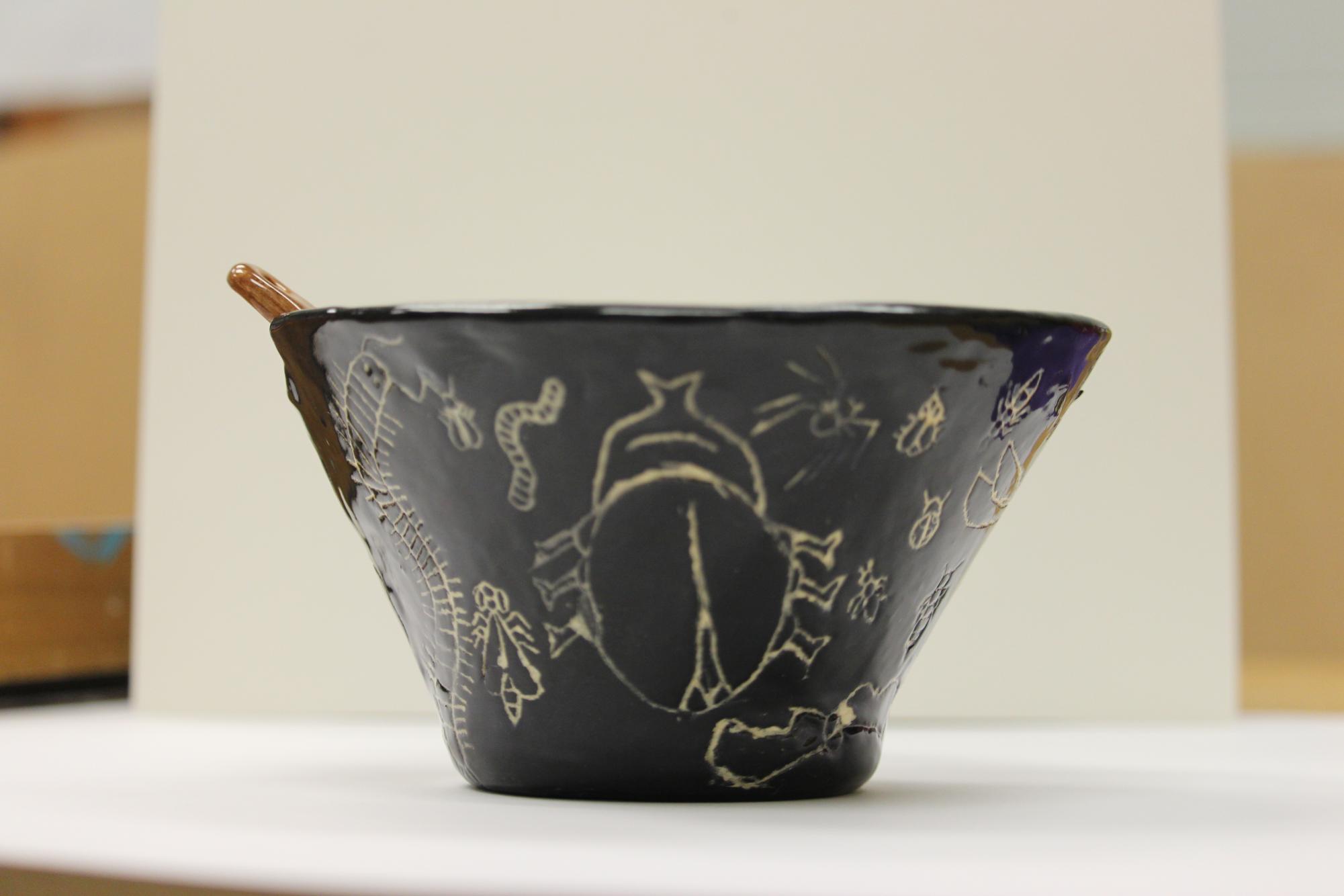 The art students in sculpture class made bowls and painted them for the nonprofit Empty Bowls.