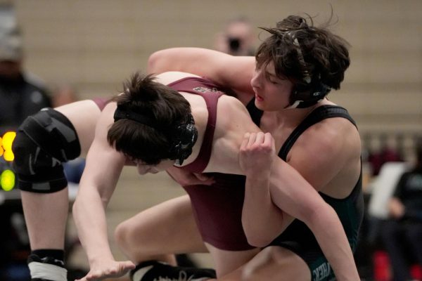 As a Summer Creek wrestler tries to regain balance, senior Tristan Rodriguez holds him down. The dual meet took place on Jan 15.