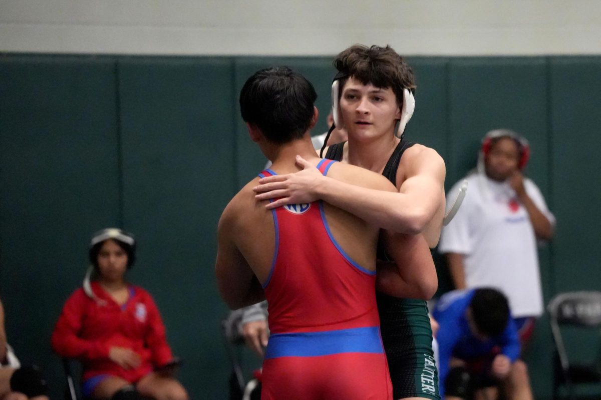 Senior Tristan Rodriguez celebrates a win on Dec. 10 in a home match. He ended his high school career as the first Kingwood Park boy to win four district titles.