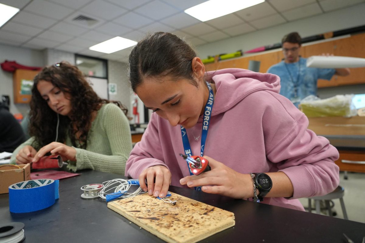 Senior Maria Maldonado works during her Aeroscience 3 class period. Though it is supposed to be an aide period, Maldonado and teacher Glenn Taylor have developed a course entirely for herself.