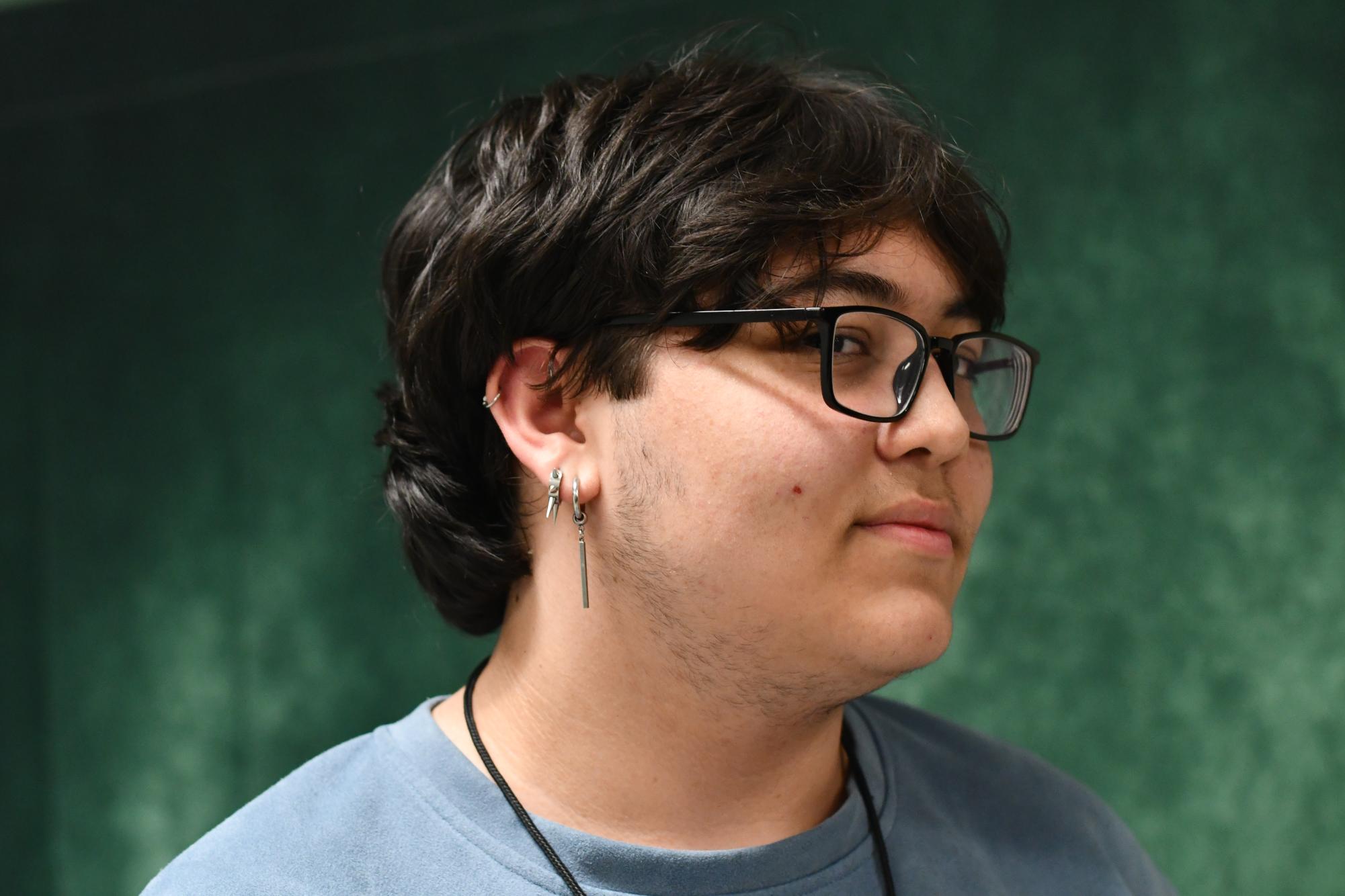 Sophomore Tyler Pavlicek shows off his earrings he wears in his right ear. He has six piercings altogether and also wears a number of rings.