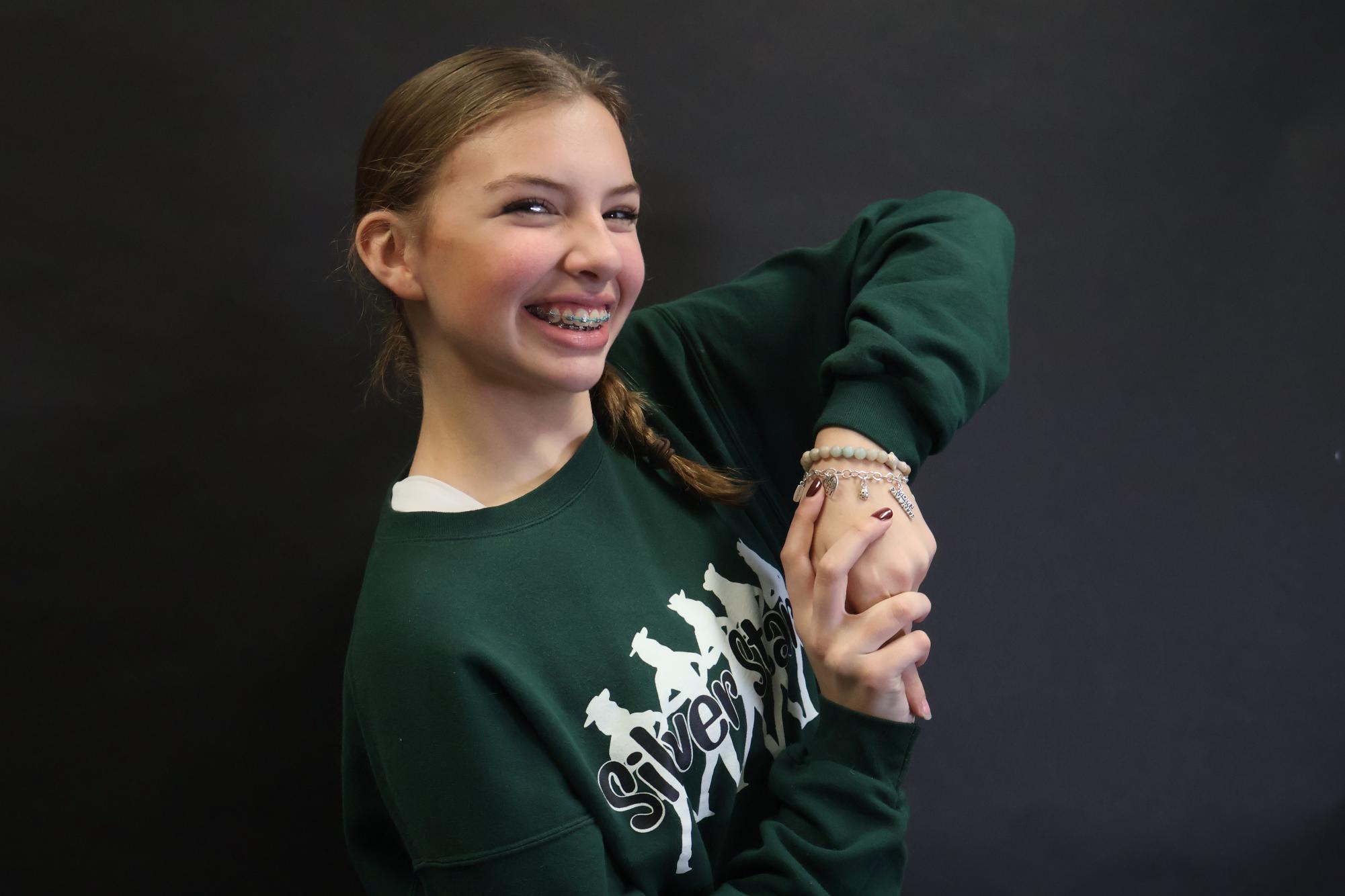 Sophomore Myla Harris shows off her charm bracelet. Her grandmother has one that weighs almost five pounds – a goal Harris has for her own bracelet someday.