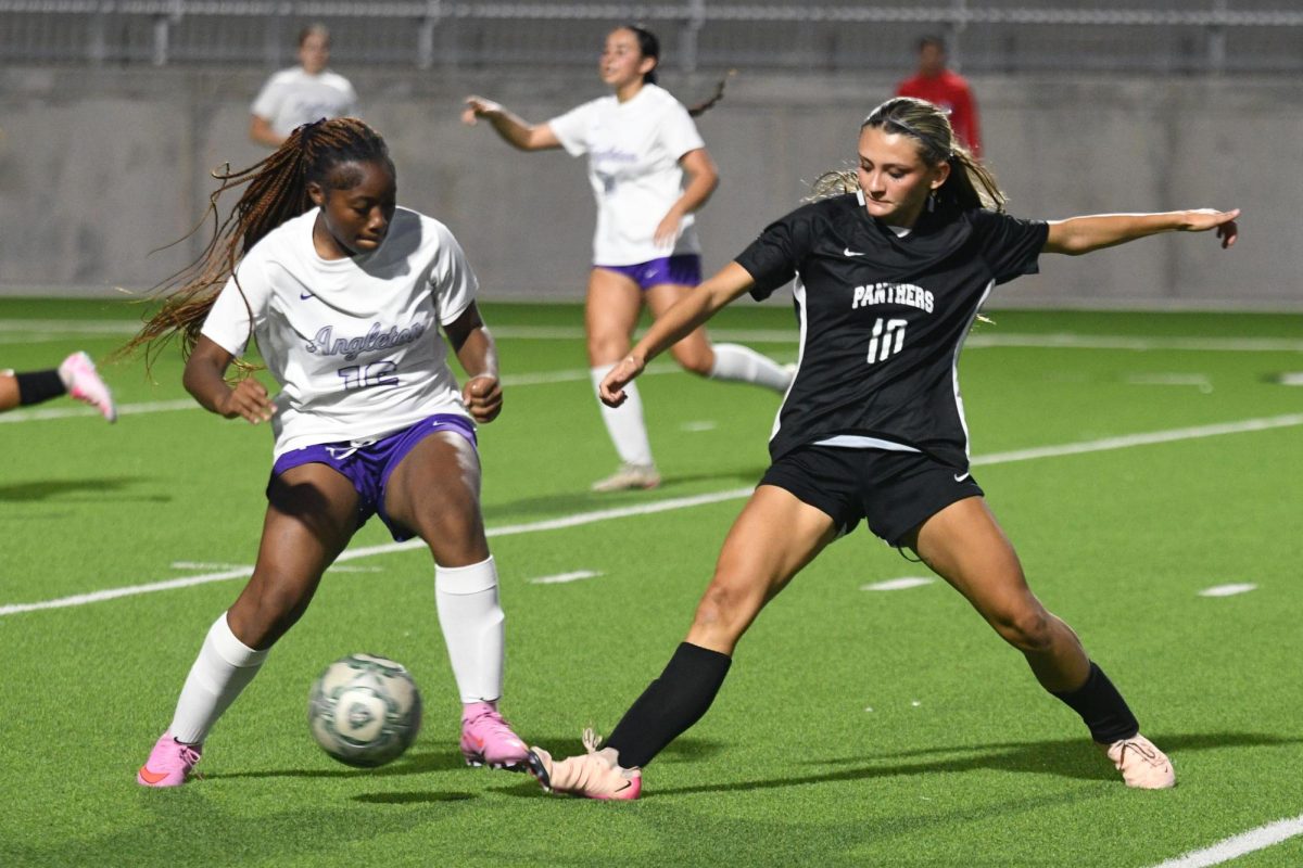 During the second half of the playoff game against Angleton, junior Madi Moffitt steps to the ball while attempting to gain possession of the ball. 