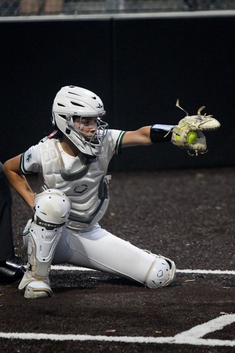 Freshman Ava Tellez frames a pitch from freshman teammate Trinity Brents during a game against Crosby on March 10. The Panthers won 3-2.